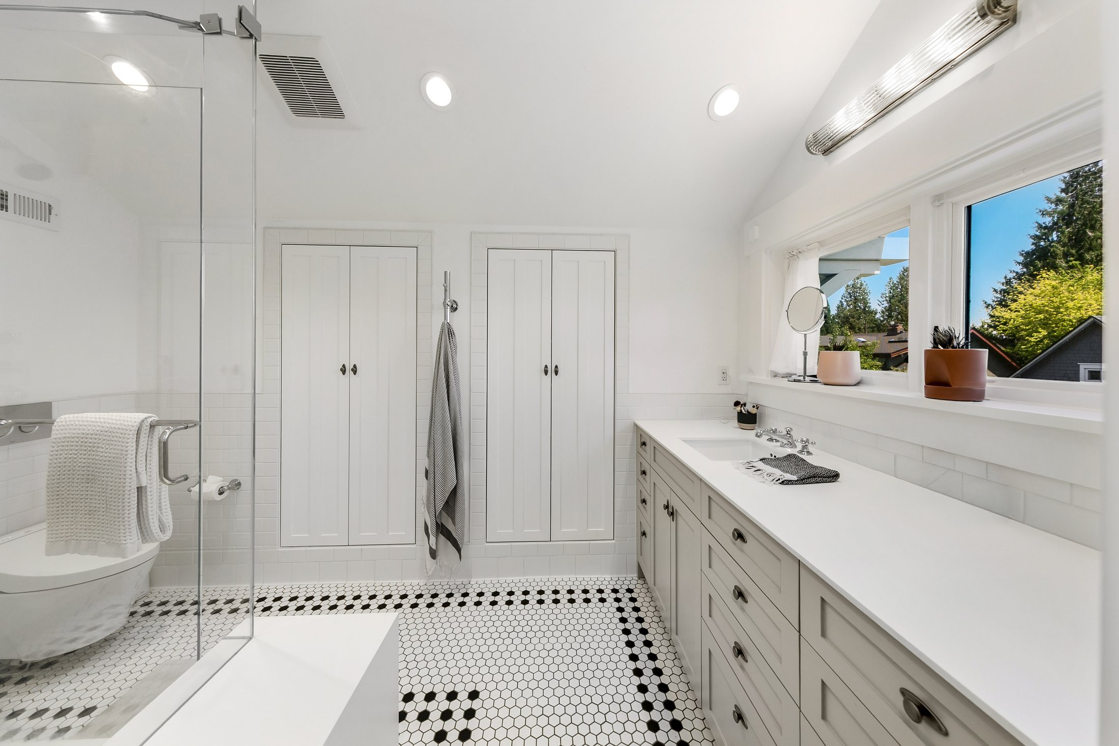 Madrona Seattle primary bathroom remodel with a steam shower, custom vanity, and mosaic tile floor