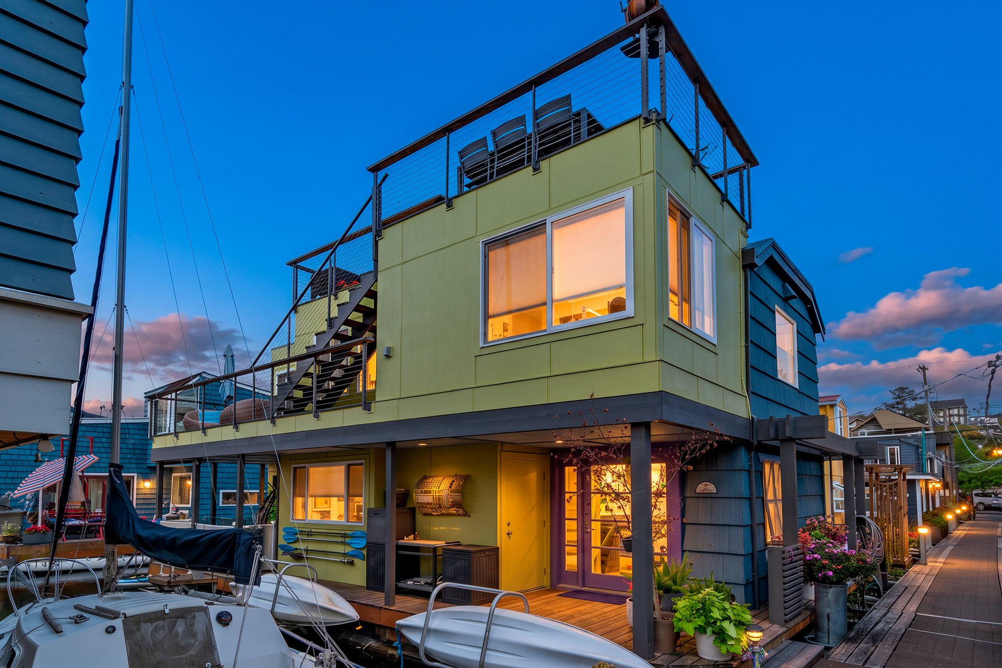 Floating Home exterior illuminated at twilight
