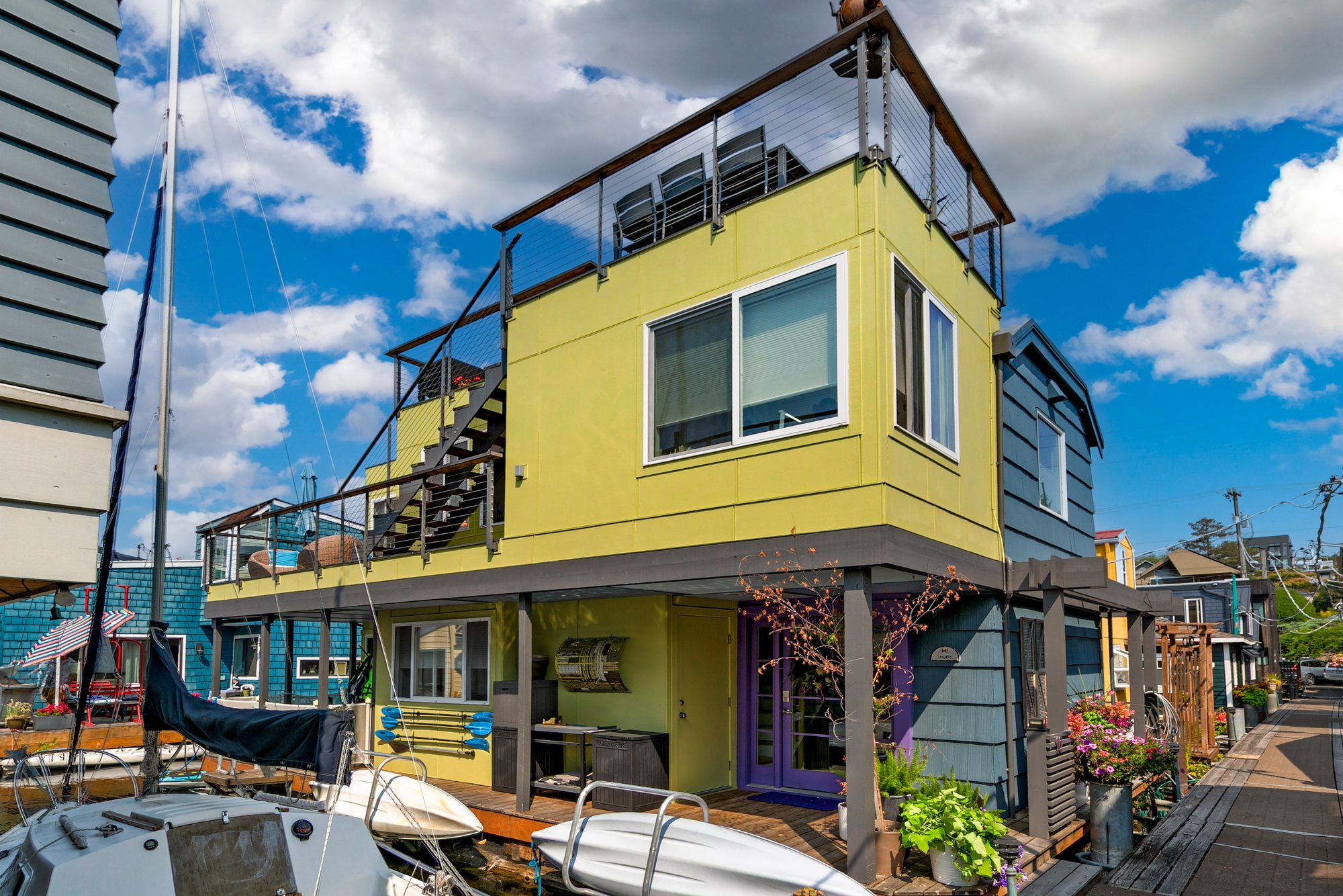 Daytime exterior of the Floating Home beside the dock