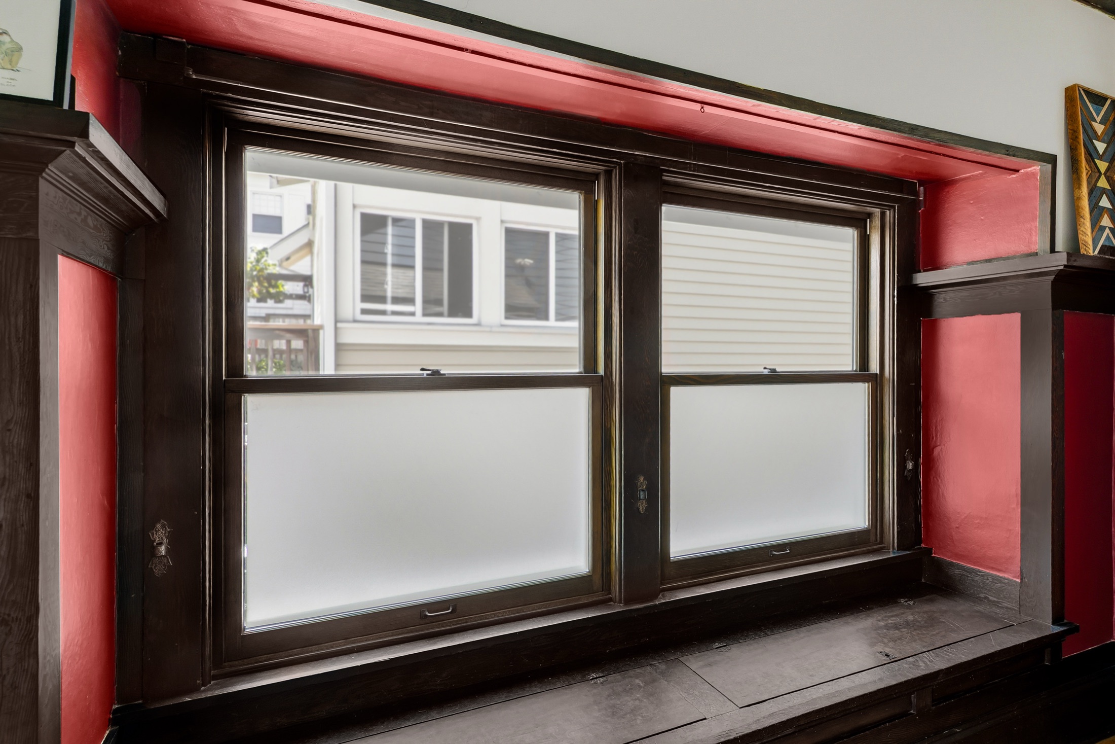 Craftsman window bay with dark wood millwork