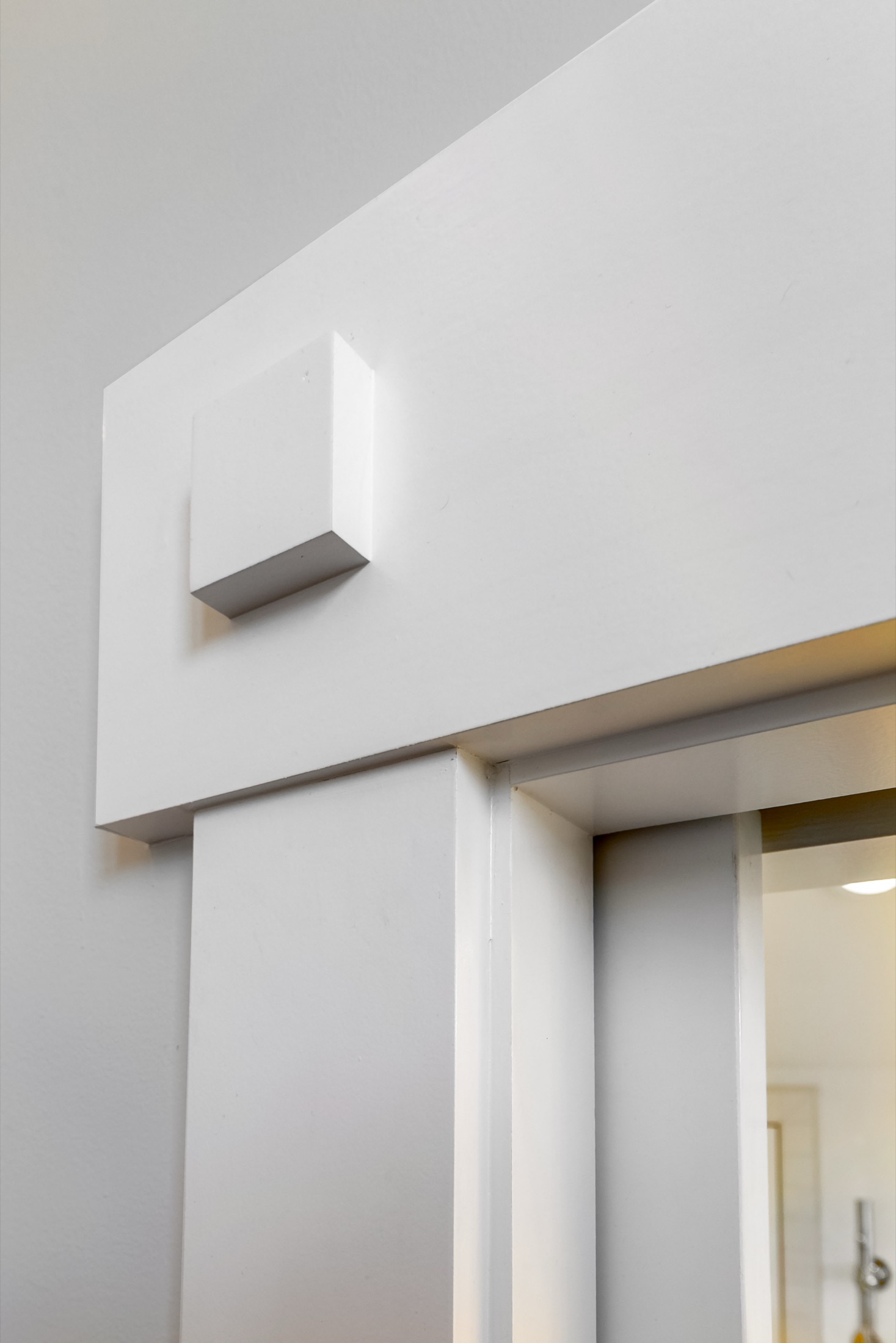 Custom sliding door hardware detail in the primary suite