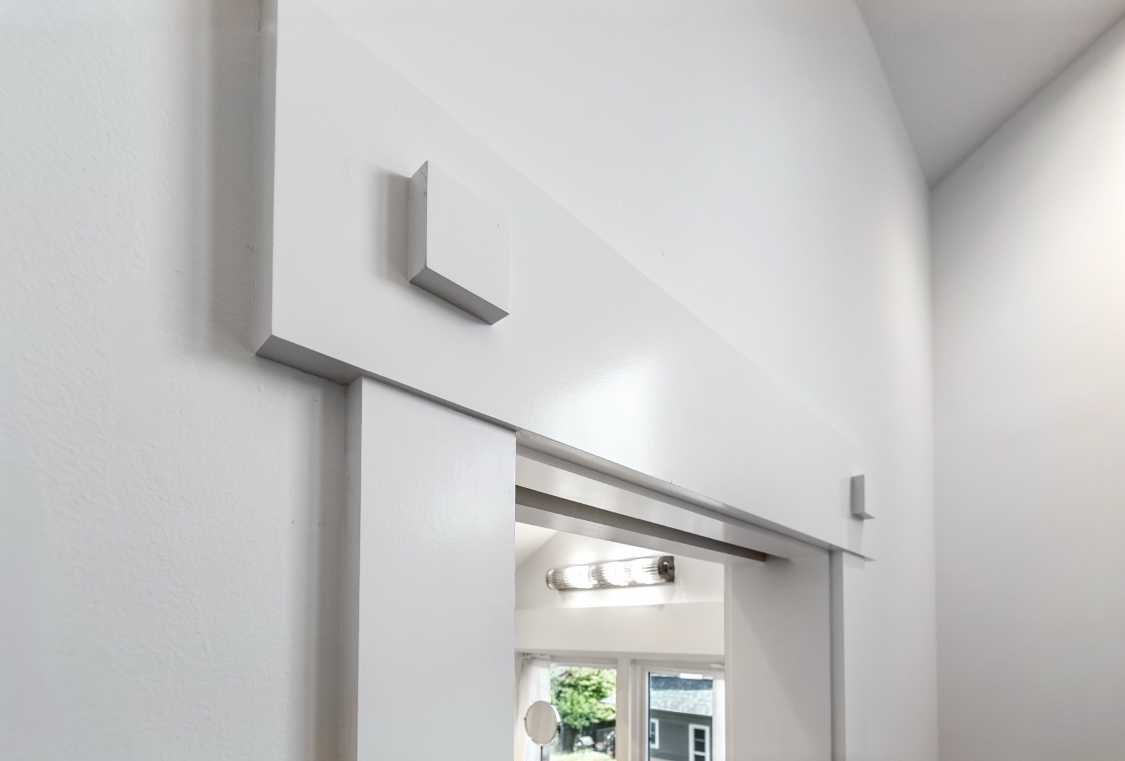 Close view of custom sliding door track and trim