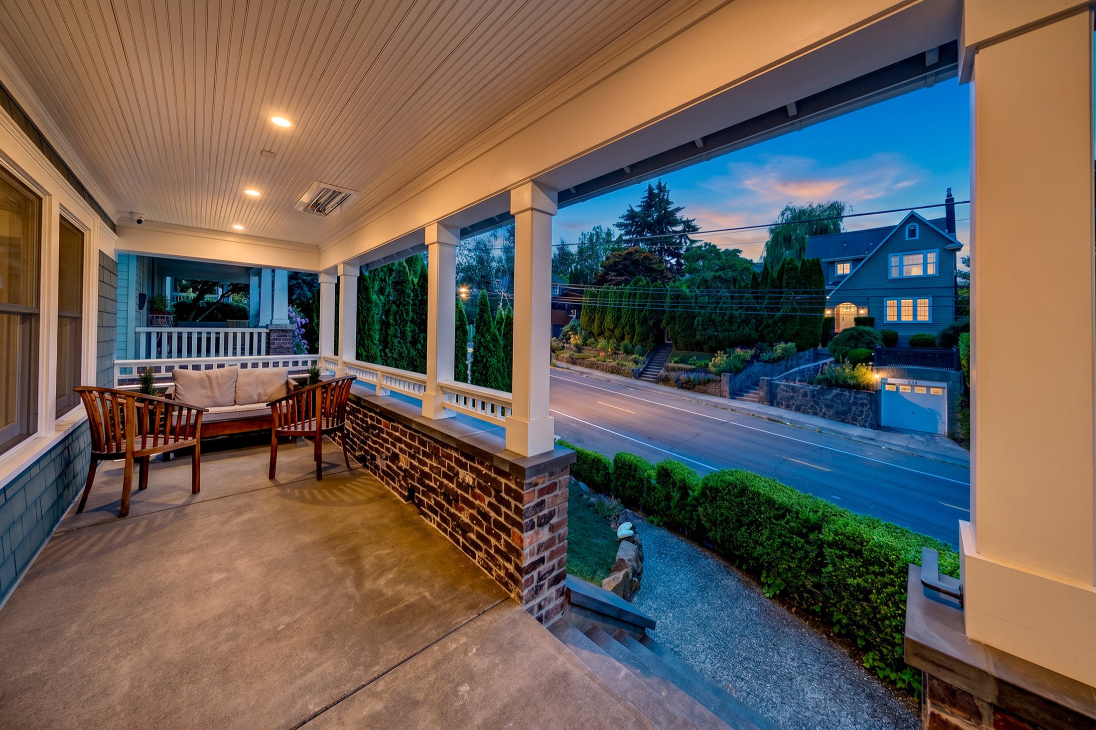 Front porch seating and street view in evening light