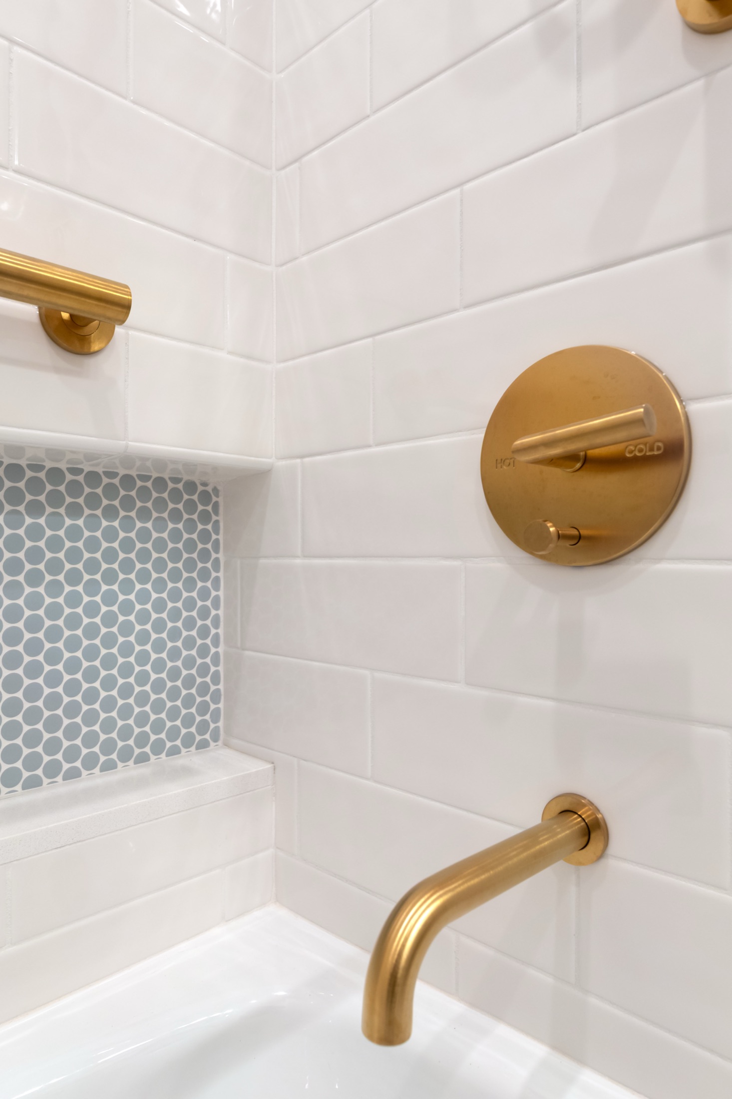 Recessed shower niche and brass tub spout