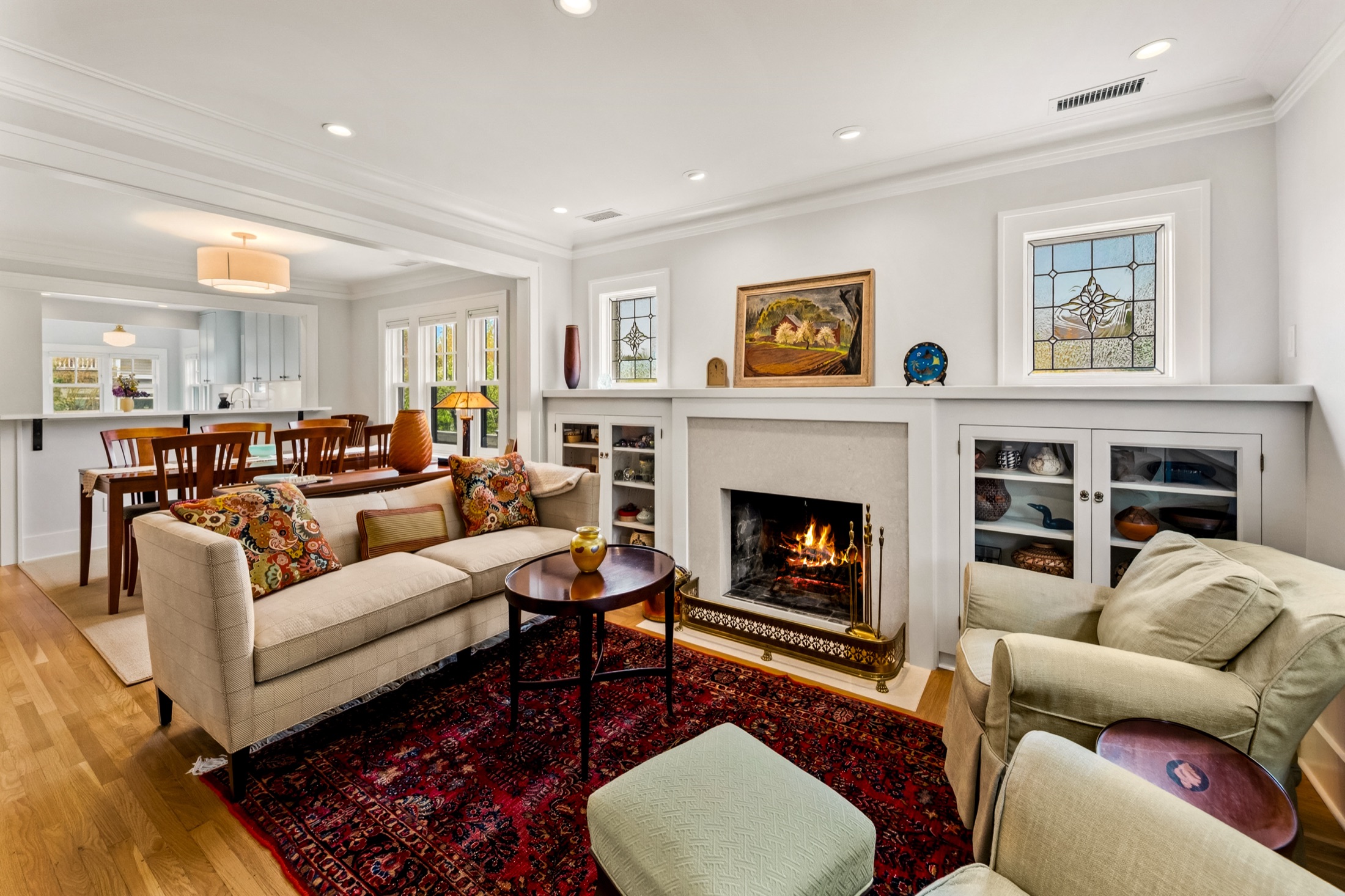 Open living room, kitchen, and fireplace after the remodel