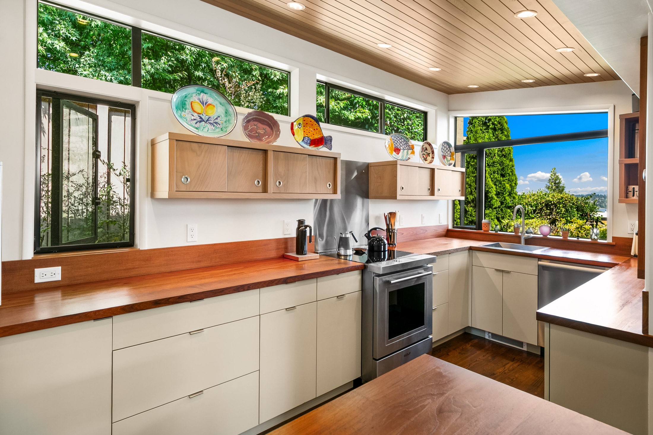 View Ridge kitchen framed by clerestory windows and a wood ceiling