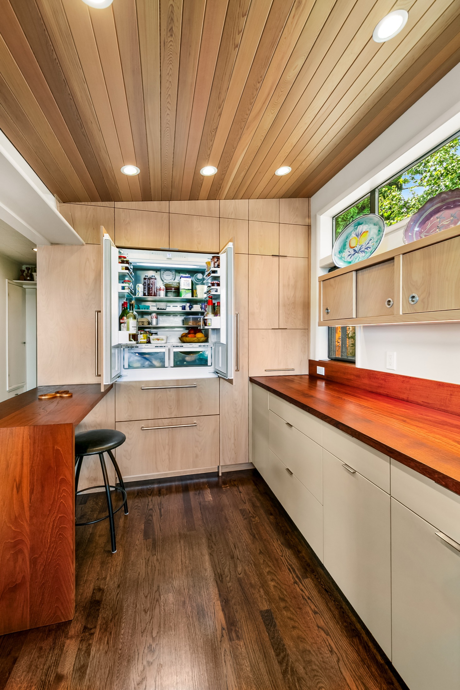 Tall pantry wall and wood ceiling in the View Ridge kitchen