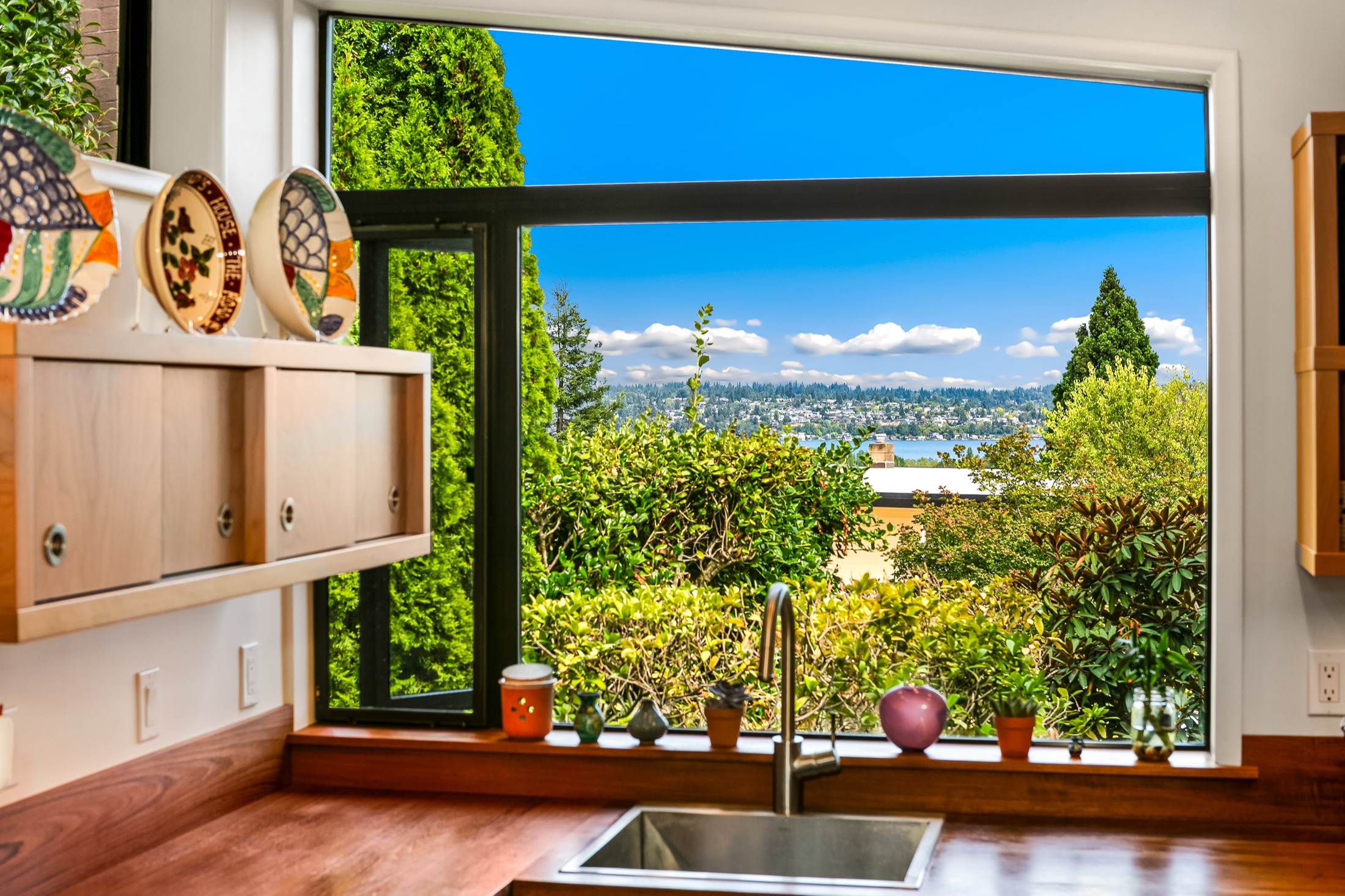 Picture window above the kitchen sink overlooking Seattle