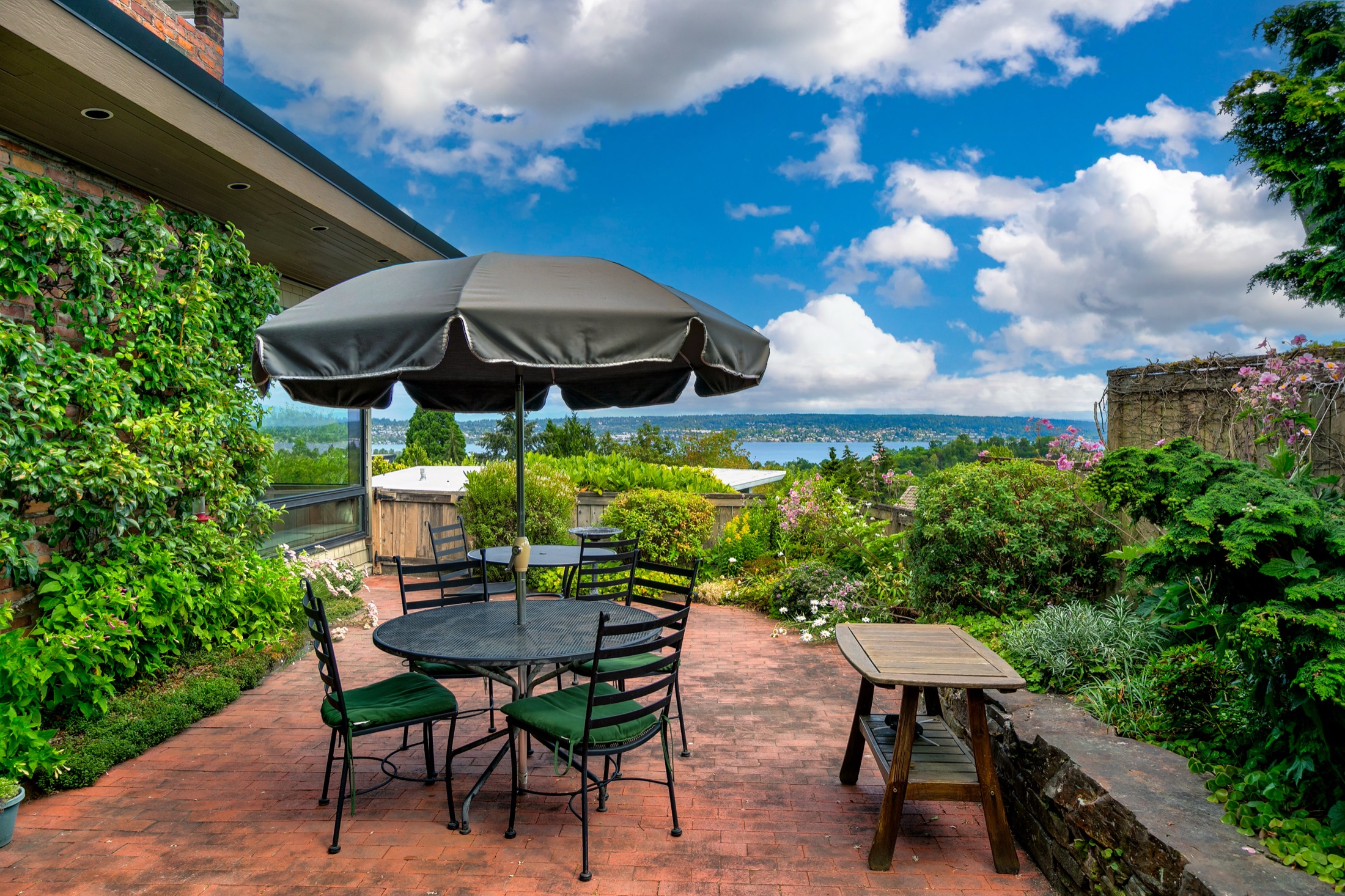 Garden terrace with seating and a wide Seattle view